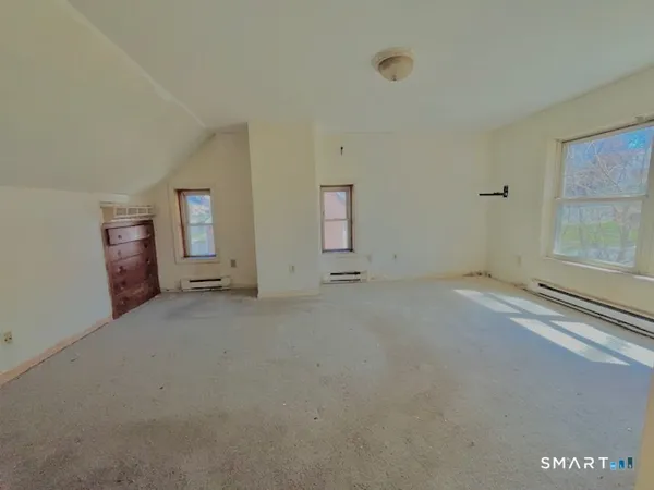a view of empty room with windows