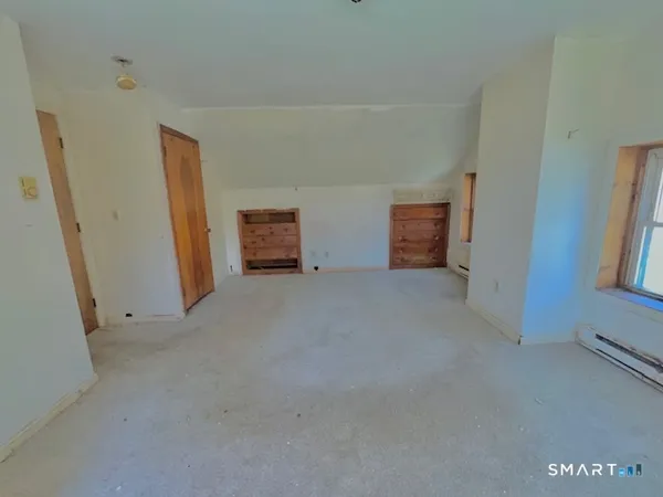 a view of empty room with windows