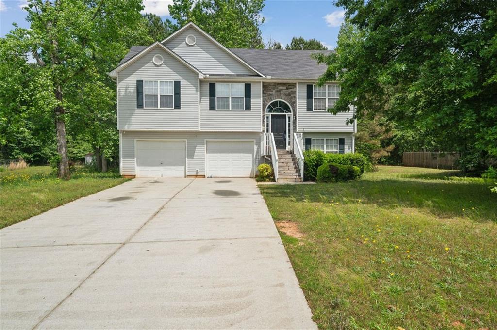 a front view of a house with yard