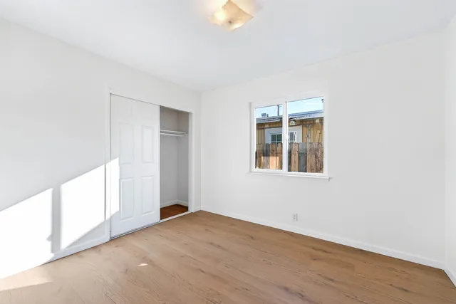 a kitchen with a sink cabinets and window