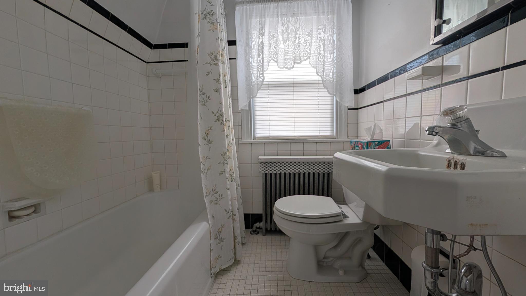 542 Crum Lynne Road Ridley Park, PA 19078 - Photo 21 of 30 Hall Bathroom w/ full ceramic tile & tub/shower.
