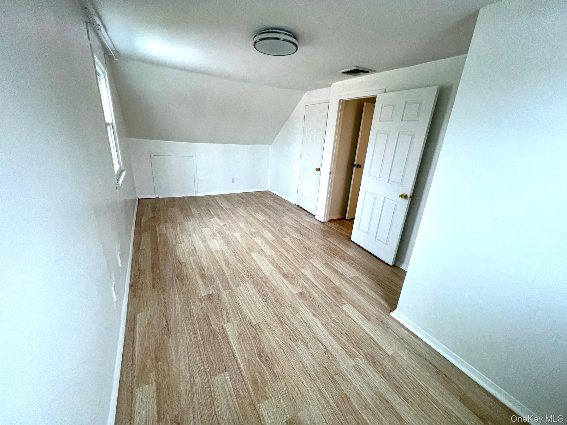 2341 Westley Road Westbury, NY 11590 - Photo 14 of 15 wooden floor in an empty room