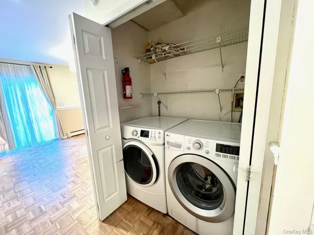 a view of a hallway with washer and dryer