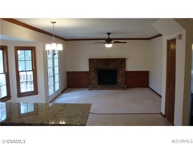 10319 North Donegal Road Chesterfield, VA 23832 - Photo 5 of 9 a living room with furniture and a fireplace
