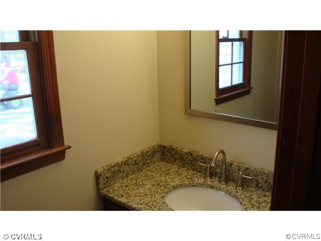 10319 North Donegal Road Chesterfield, VA 23832 - Photo 9 of 9 a bathroom with a sink and a mirror