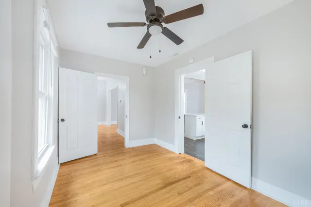 a bathroom with a toilet and a mirror