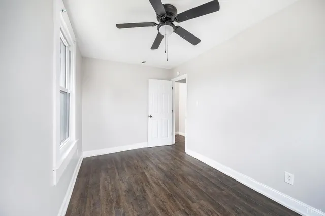 a bathroom with a toilet sink and a mirror