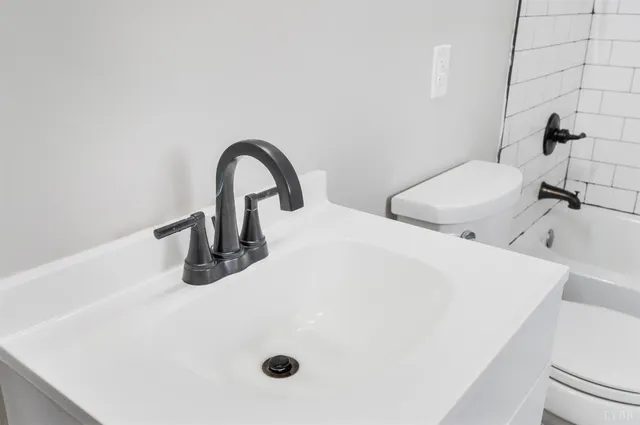 a bathroom with a shower and a shower