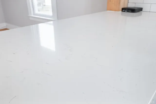 a stove top oven sitting inside of a kitchen