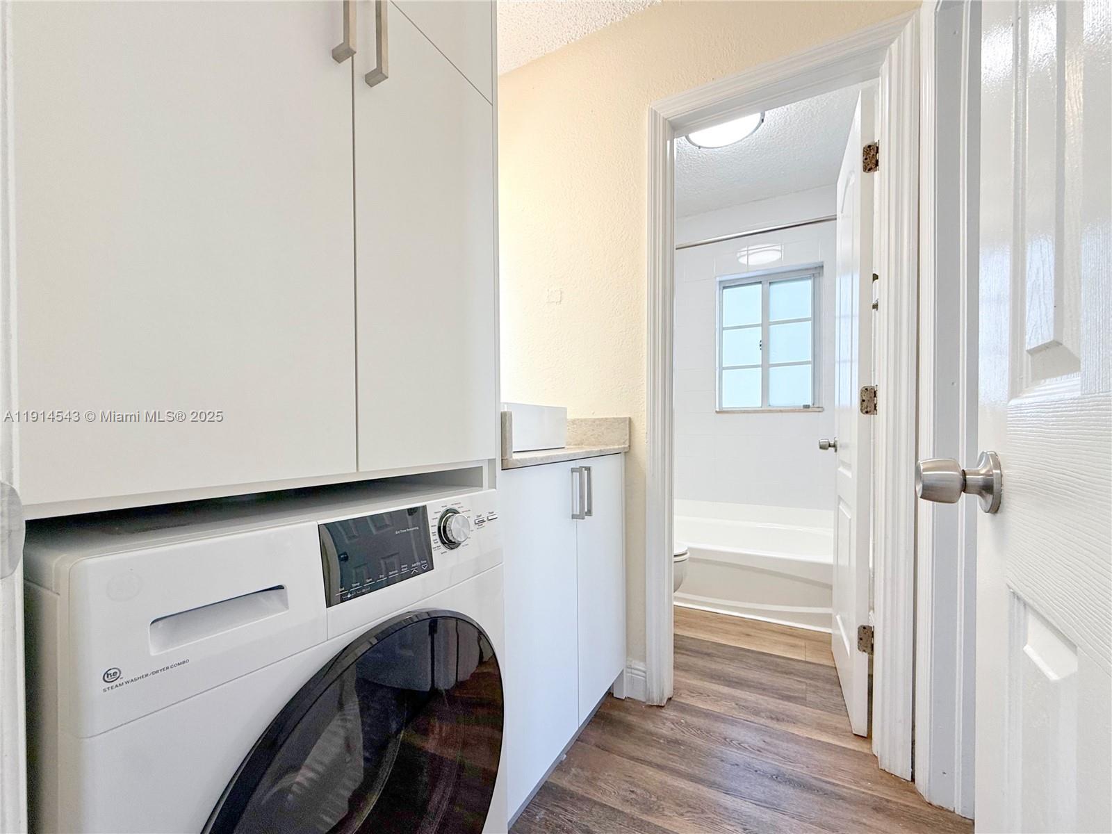 5231 Geneva Court, Unit 307 Doral, FL 33166 - Photo 14 of 26 a view of walk in closet with wooden floor