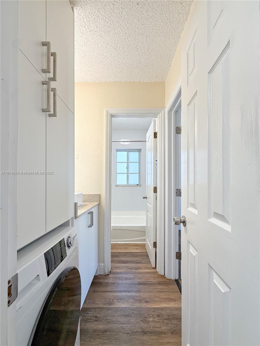 5231 Geneva Court, Unit 307 Doral, FL 33166 - Photo 15 of 26 a view of a hallway with wooden floor and staircase