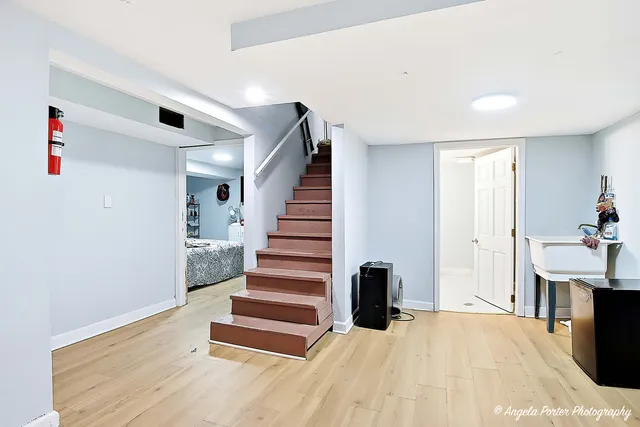a view of entryway with furniture and wooden floor