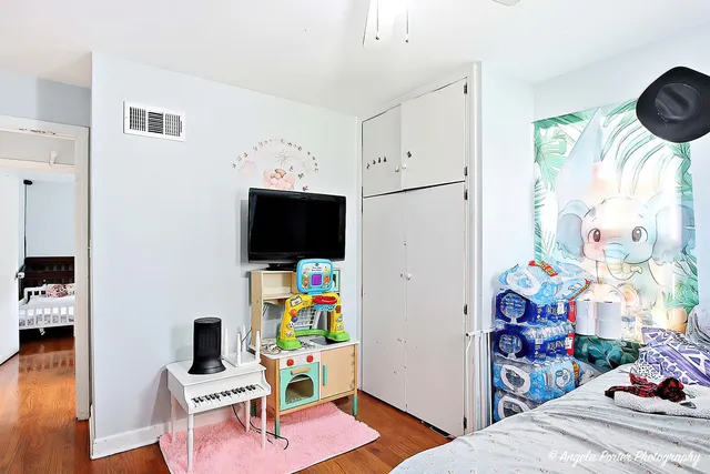 a room with furniture and a flat screen tv