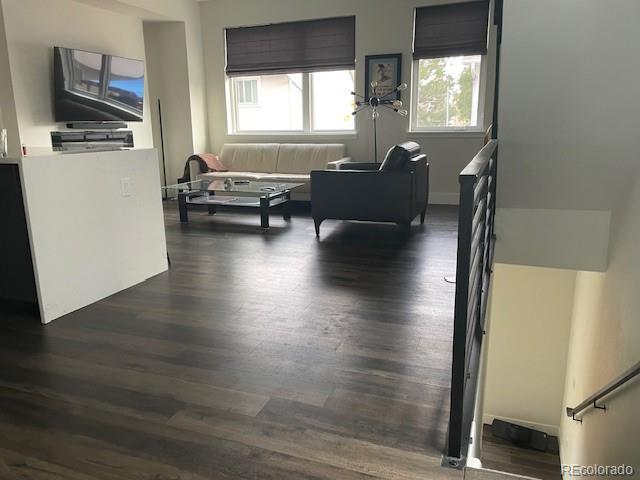 1204 South Reed Street Lakewood, CO 80232 - Photo 12 of 28 a living room with furniture window and wooden floor