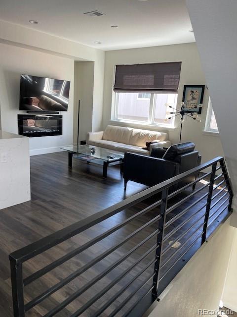 1204 South Reed Street Lakewood, CO 80232 - Photo 13 of 28 a living room with furniture and flat screen tv