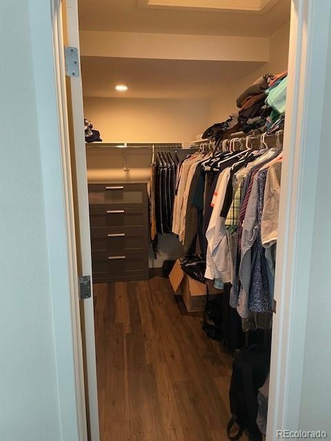 1204 South Reed Street Lakewood, CO 80232 - Photo 19 of 28 a view of walk in closet with clothes and shoes