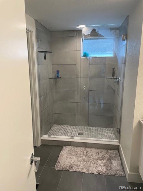 1204 South Reed Street Lakewood, CO 80232 - Photo 20 of 28 a bathroom with a shower