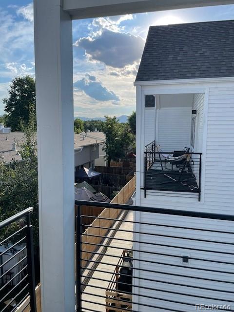 1204 South Reed Street Lakewood, CO 80232 - Photo 24 of 28 a balcony with table and chairs