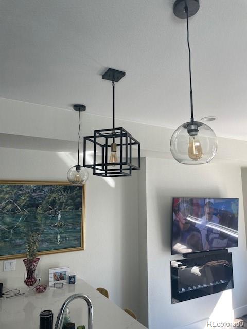 1204 South Reed Street Lakewood, CO 80232 - Photo 9 of 28 a bathroom with a sink and a mirror