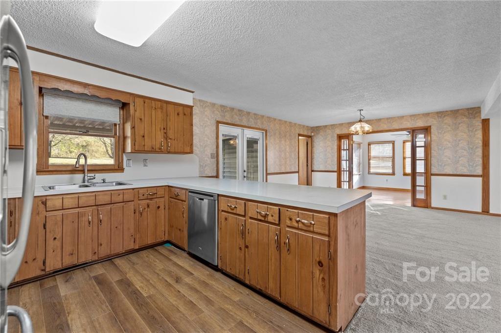 748 Bolick Road Indian Land, SC 29707 - Photo 11 of 39 a large kitchen with stainless steel appliances granite countertop a large counter top and a stove