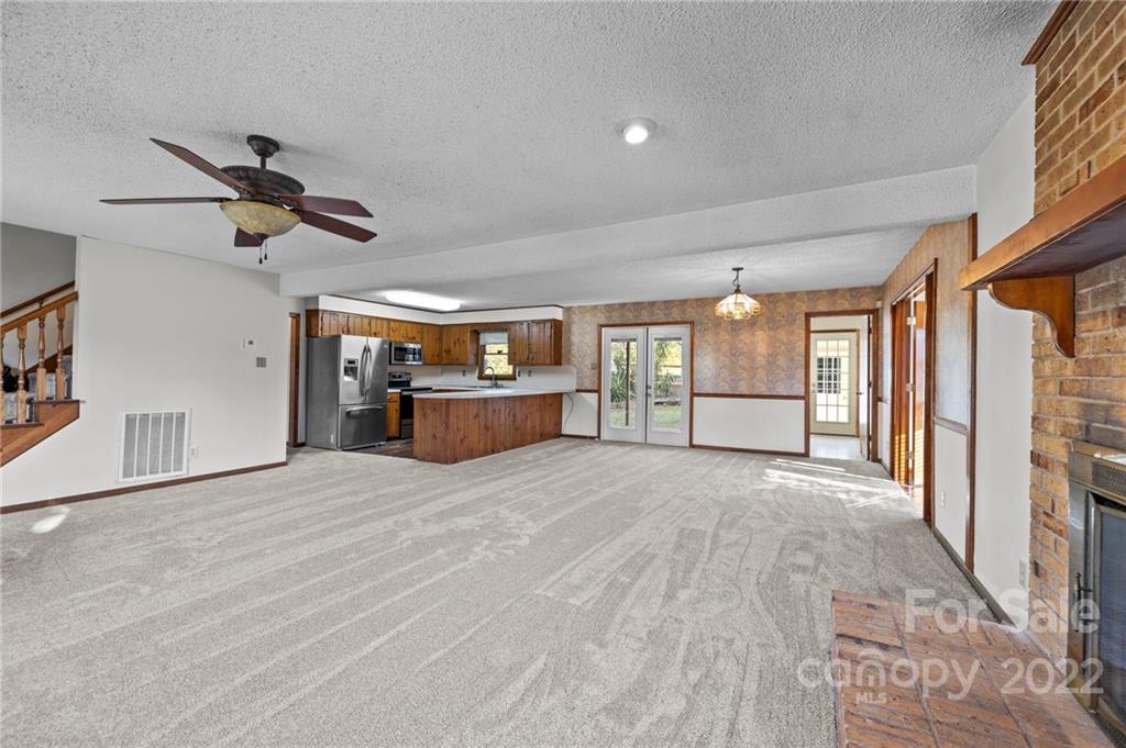 748 Bolick Road Indian Land, SC 29707 - Photo 18 of 39 a view of empty room with wooden floor and fan