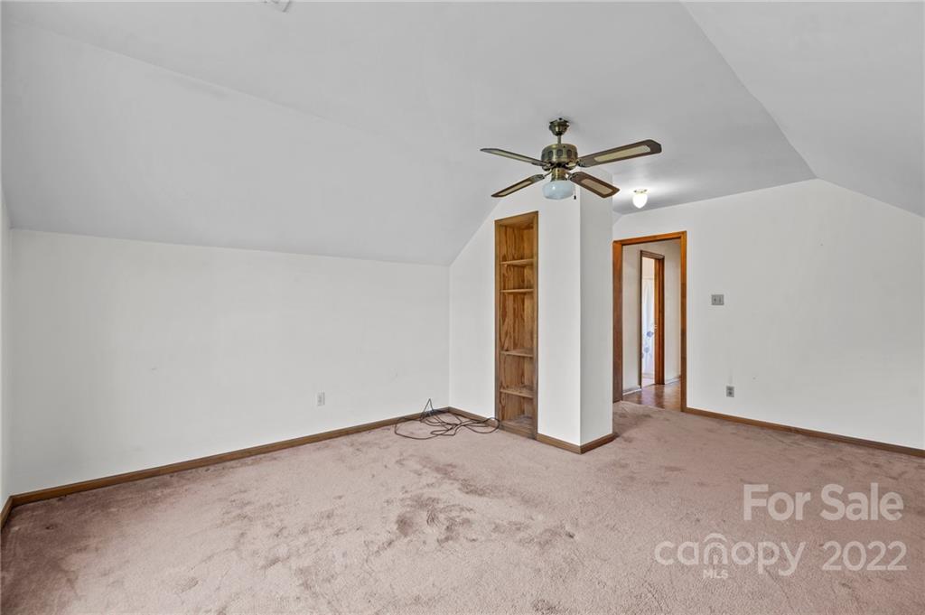 748 Bolick Road Indian Land, SC 29707 - Photo 21 of 39 an empty room with closet and a ceiling fan
