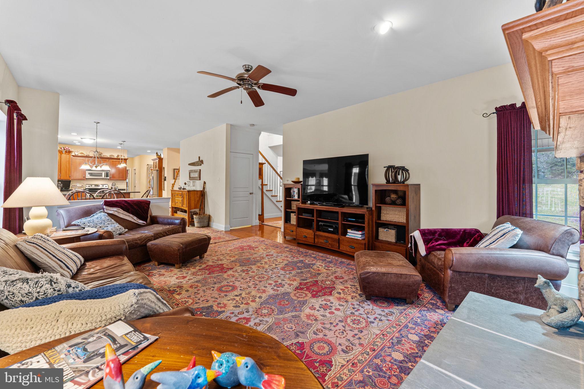 2881 Chestnut Hill Road Pottstown, PA 19465 - Photo 13 of 40 a living room with furniture a rug and a flat screen tv