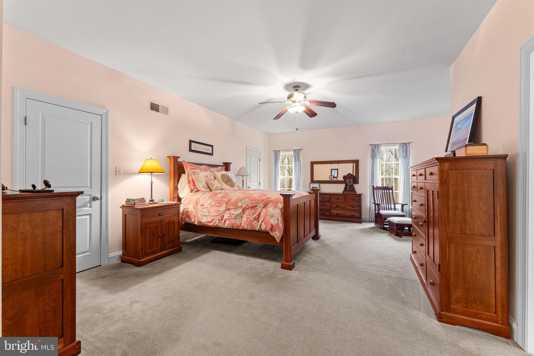 2881 Chestnut Hill Road Pottstown, PA 19465 - Photo 20 of 40 a bedroom with a bed dresser and wooden floor