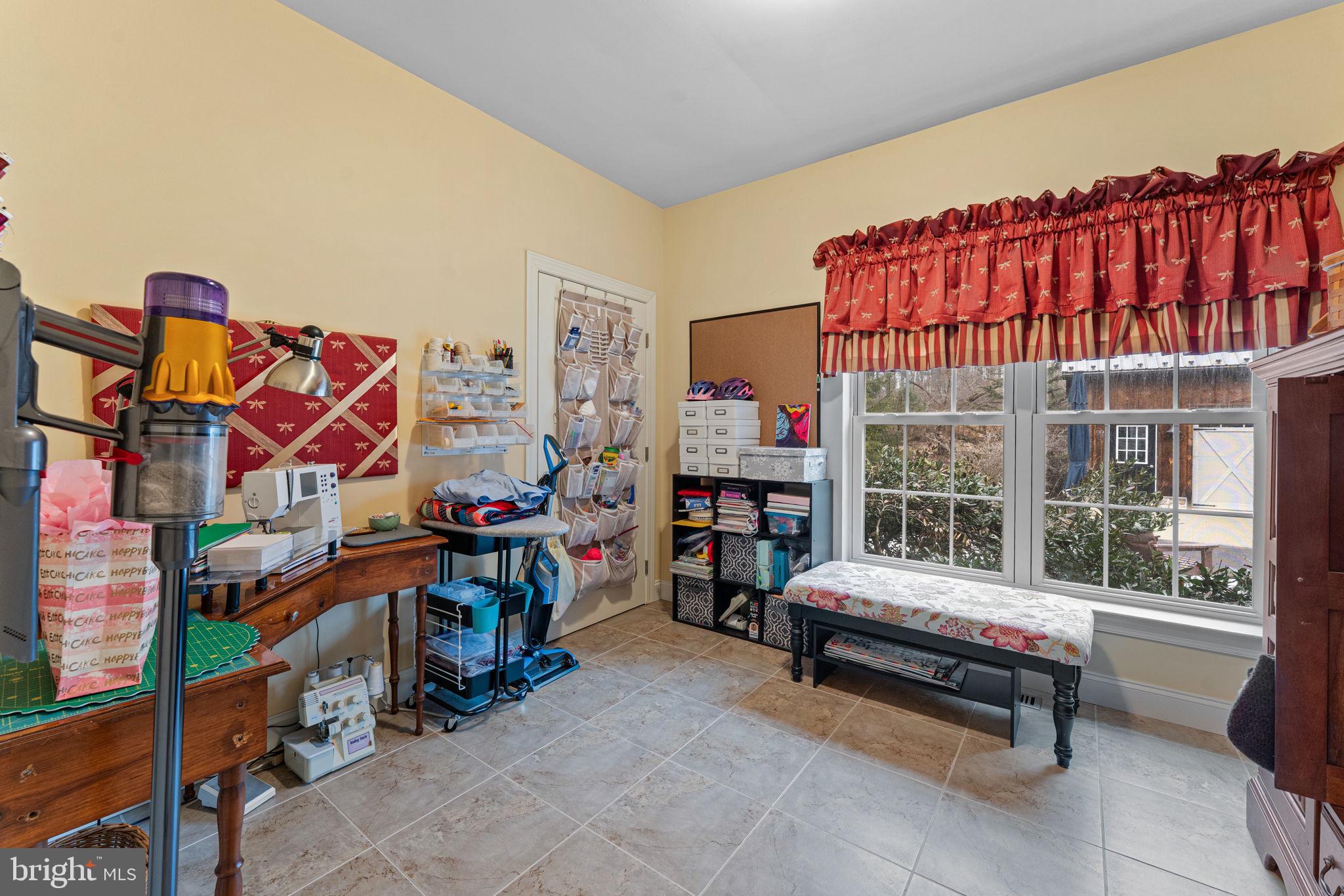 2881 Chestnut Hill Road Pottstown, PA 19465 - Photo 23 of 40 a living room filled with furniture and a chandelier