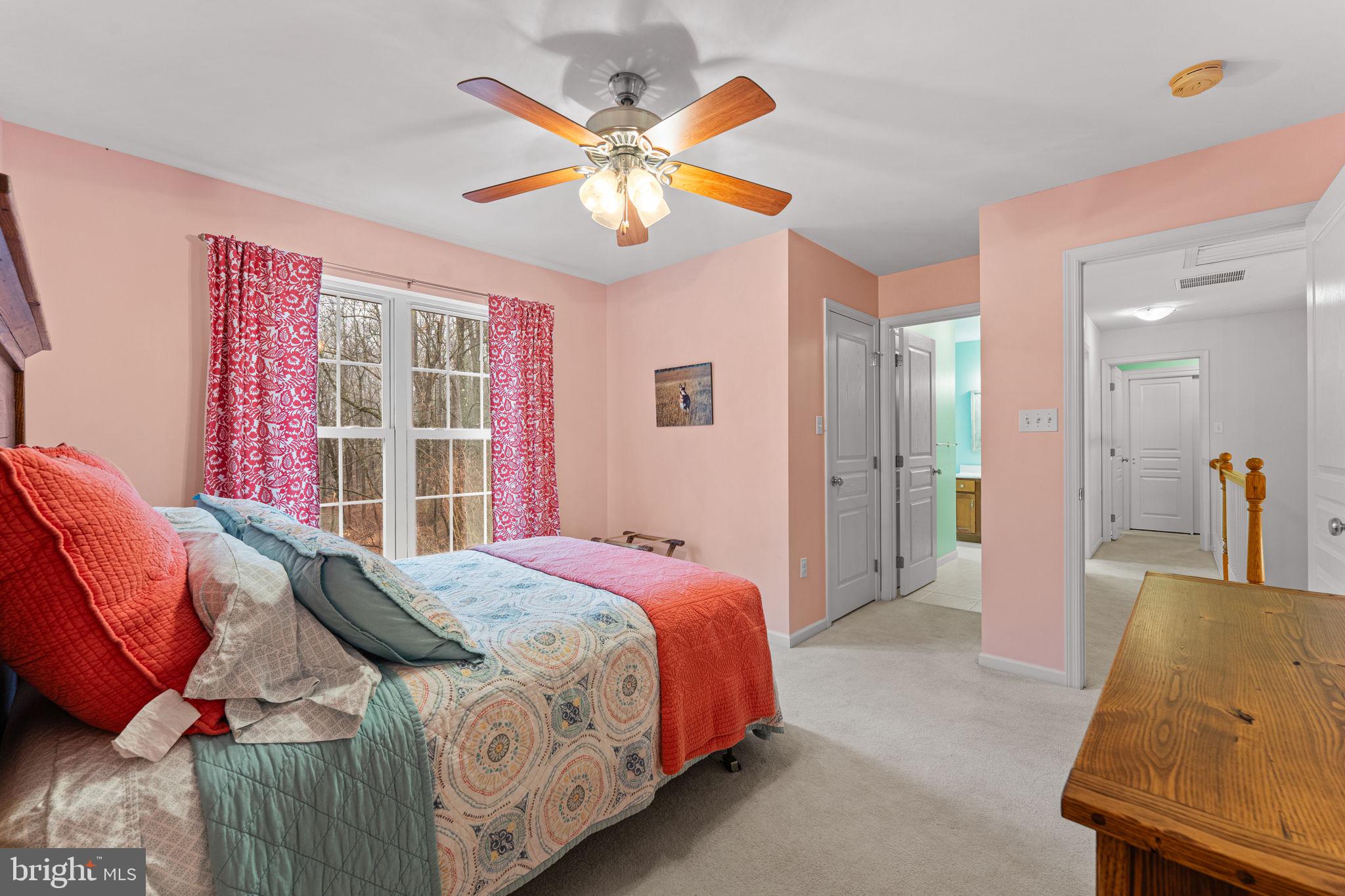 2881 Chestnut Hill Road Pottstown, PA 19465 - Photo 29 of 40 a bedroom with a bed and a chandelier
