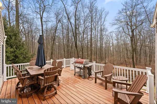 a view of a chairs and table on the deck