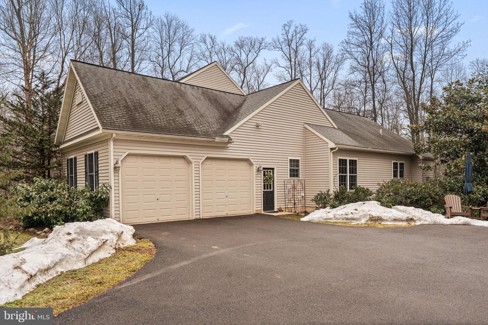 2881 Chestnut Hill Road Pottstown, PA 19465 - Photo 6 of 40 a view of a house with a yard covered in snow