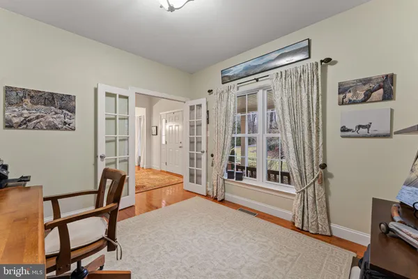 a bedroom with furniture and a window