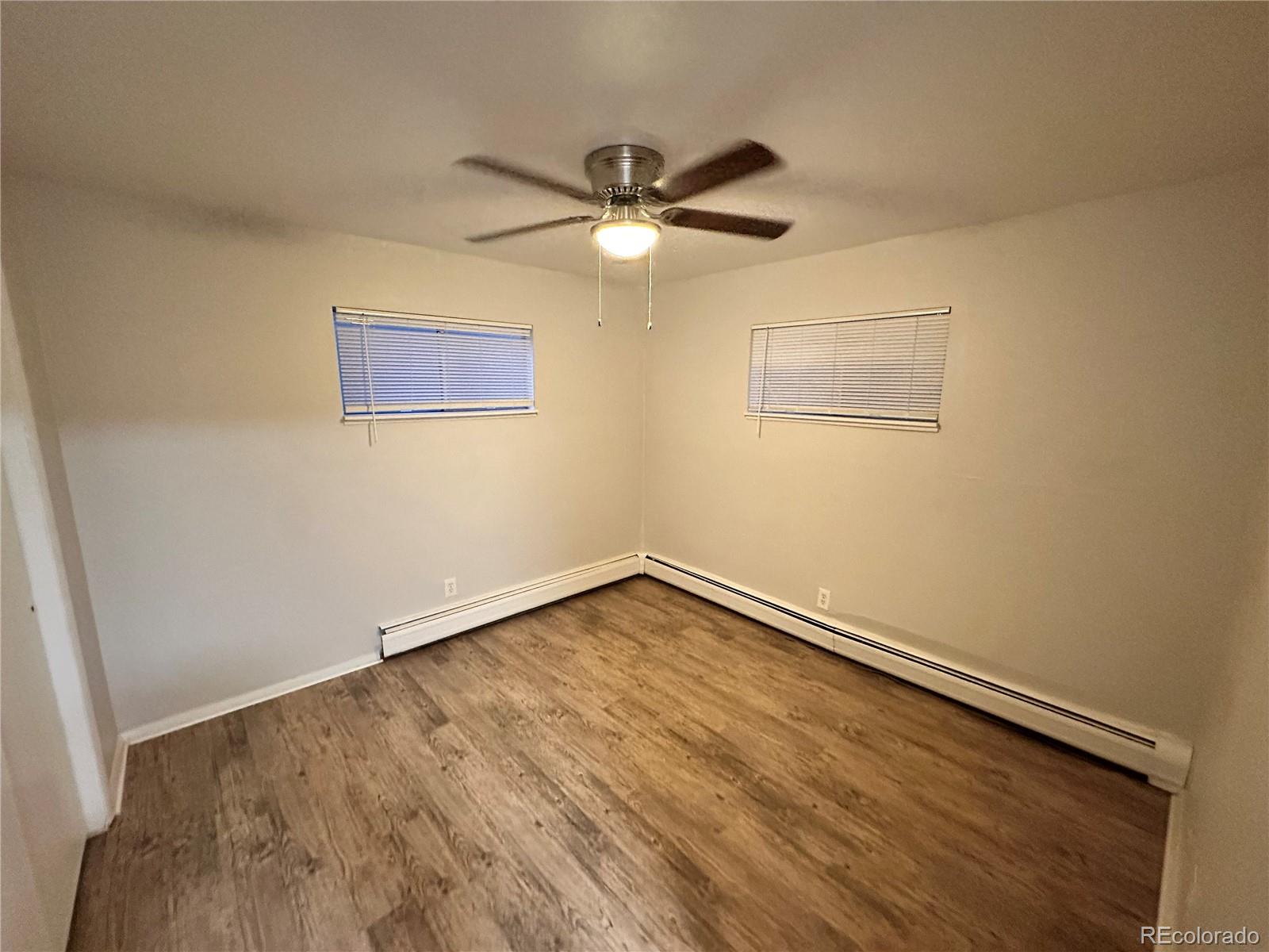 6190 Webster Street Arvada, CO 80003 - Photo 5 of 6 a view of an empty room with a window