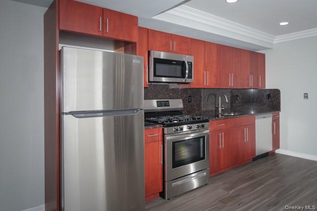 311 West Main Street, Unit 28 Patchogue, NY 11772 - Photo 3 of 9 a kitchen with stainless steel appliances granite countertop a refrigerator stove and microwave