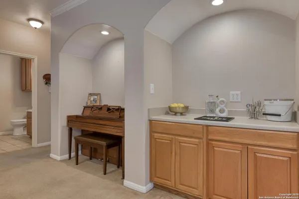 a kitchen with sink and cabinets