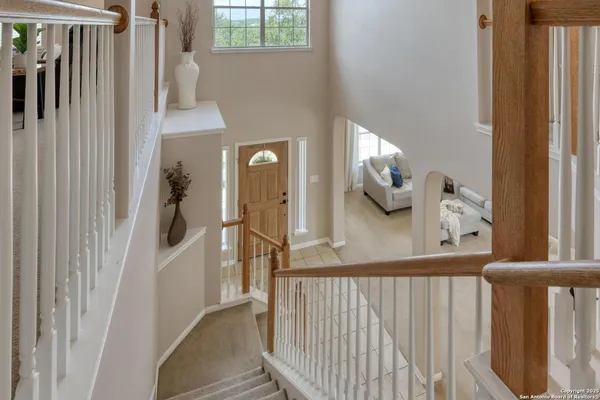 a bedroom with a bed and a flat tv screen