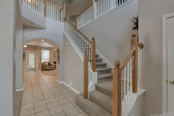 a view of staircase and kitchen floor