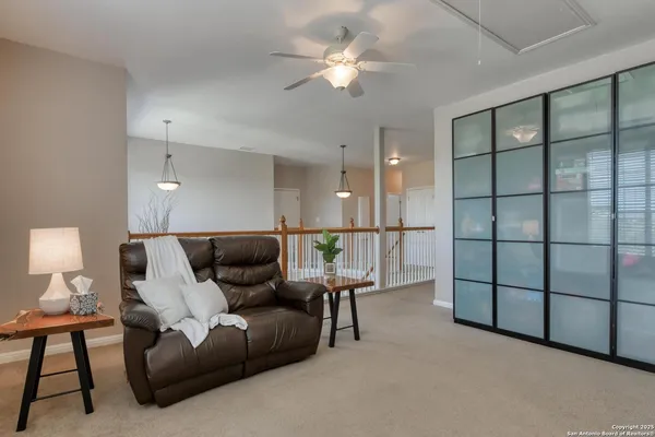 a view of a hallway with living room and furniture
