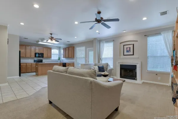 a living room with furniture and a fireplace