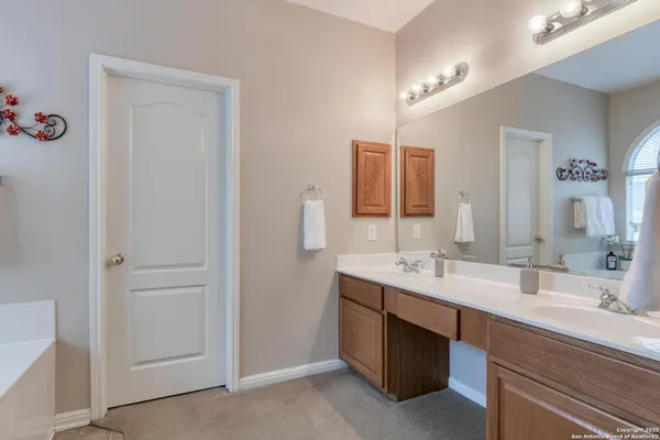 a bathroom with a tub and a sink