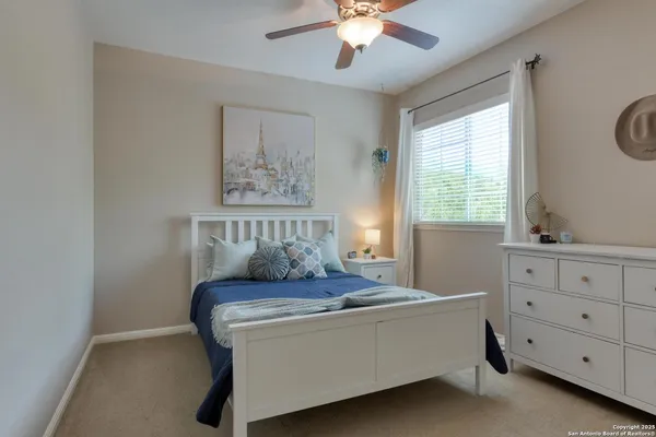 a bathroom with 2 sink toilet and a mirror
