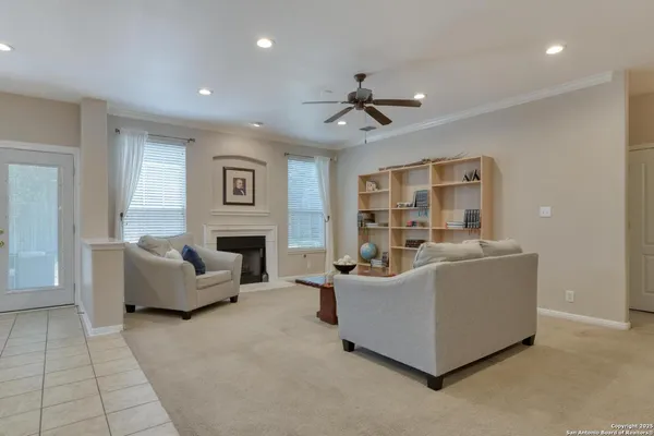 a living room with furniture and a fireplace