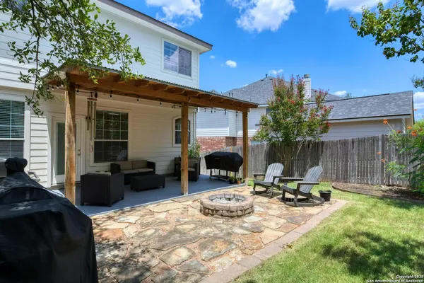 a view of a backyard with furniture