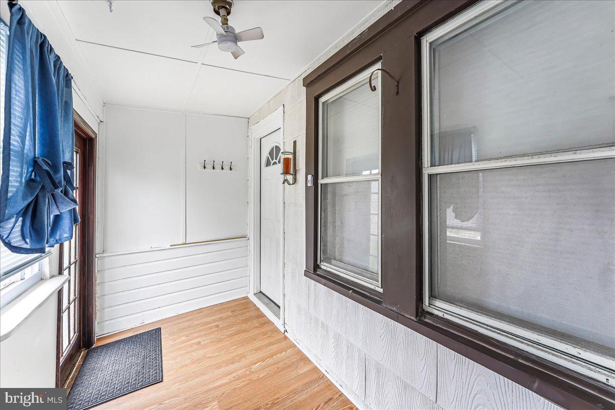 632 Taylor Avenue Upper Chichester, PA 19061 - Photo 2 of 20 a view of a hallway with wooden floor and staircase