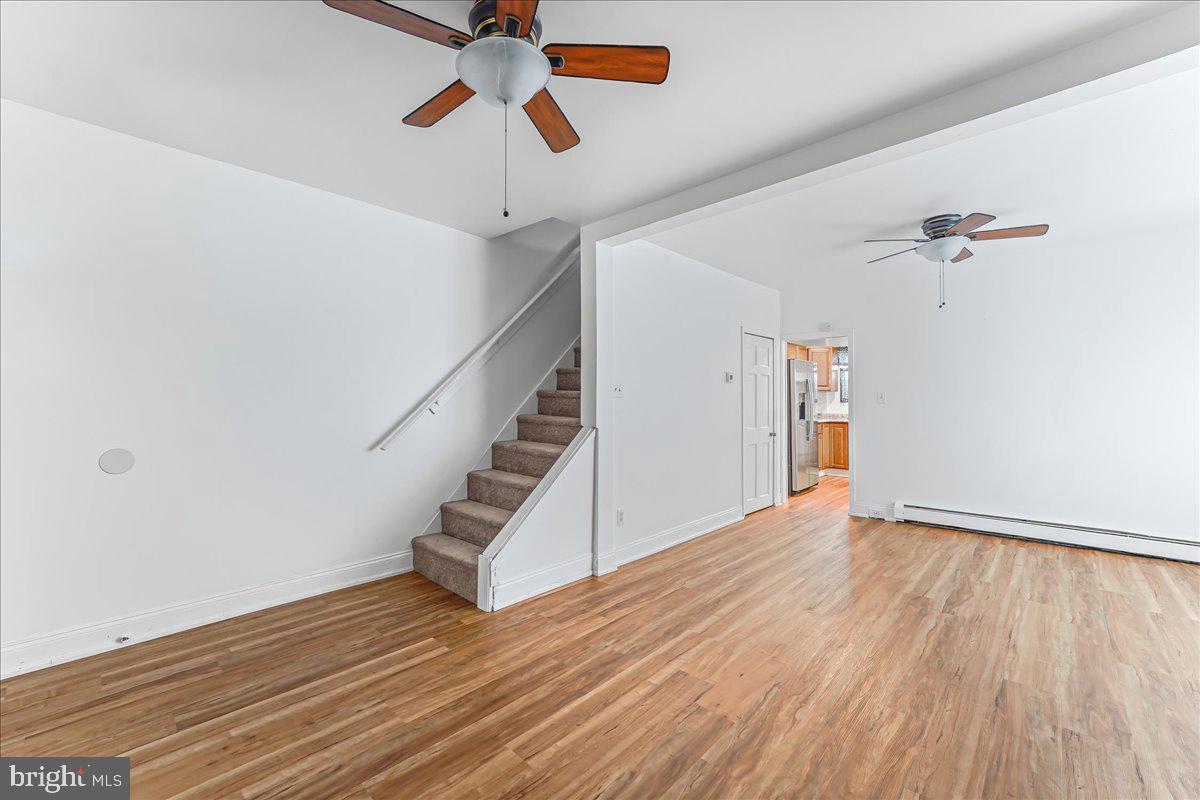632 Taylor Avenue Upper Chichester, PA 19061 - Photo 7 of 20 wooden floor in an empty room with a window