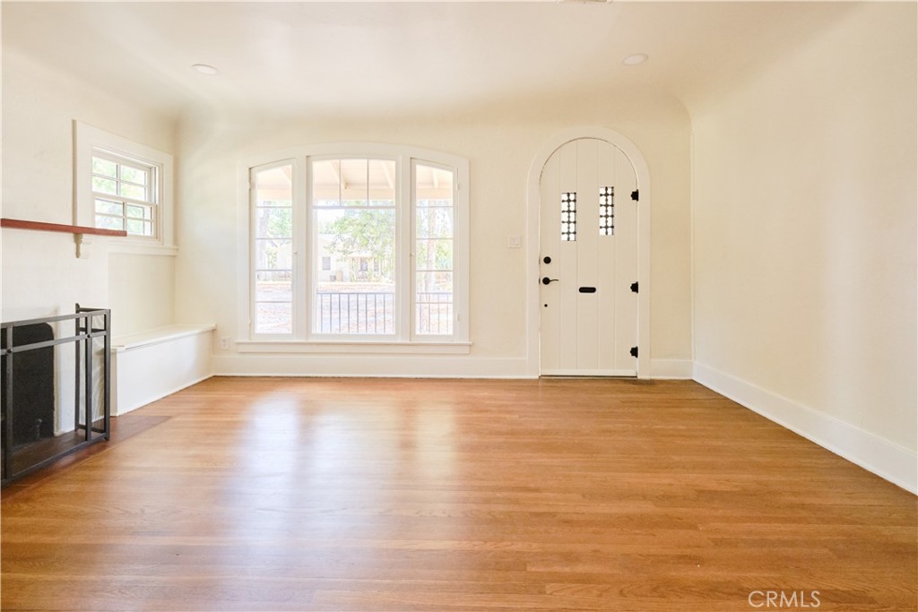 3045 Cedar Street Riverside, CA 92501 - Photo 4 of 25 Living space with fireplace, wood flooring, recessed lighting throughout house