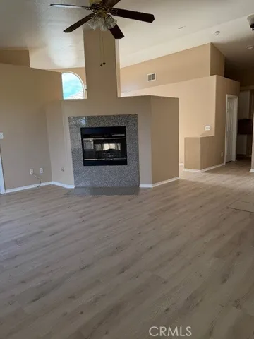 a view of an empty room with a fireplace