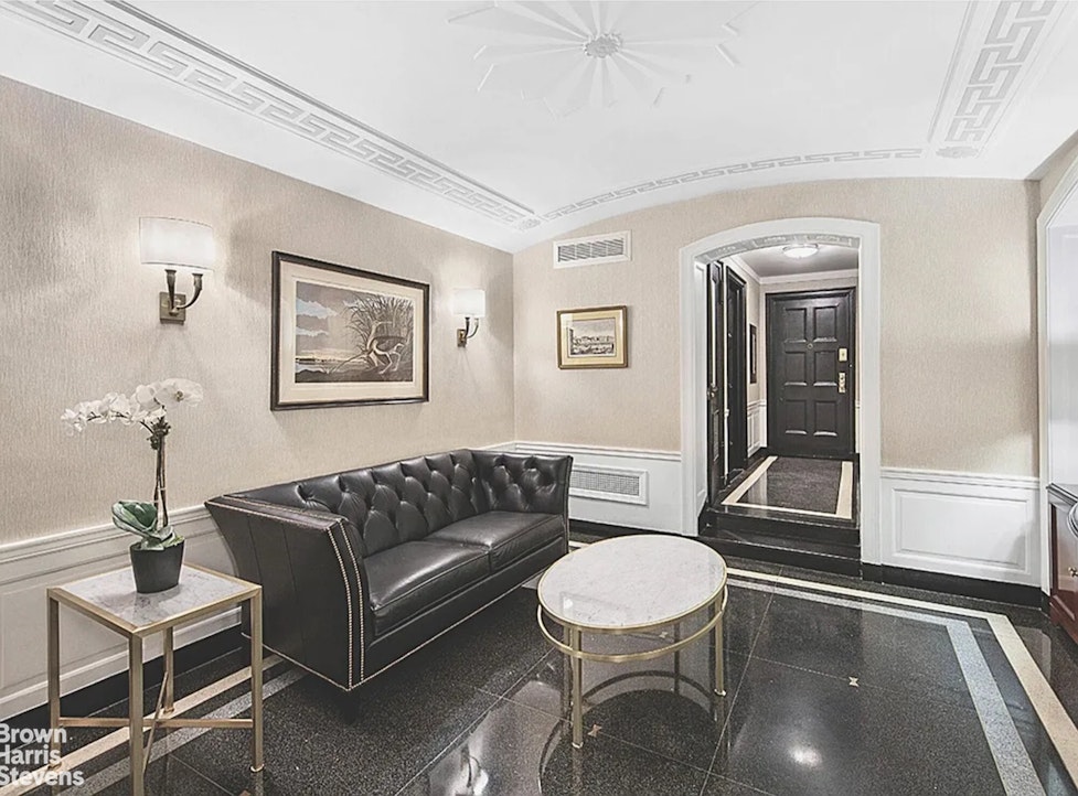 220 East 73rd Street, Unit 9H Manhattan, NY 10021 - Photo 10 of 15 a living room with furniture and a potted plant