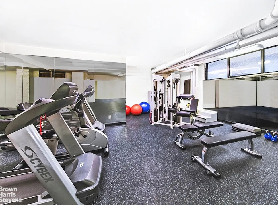 220 East 73rd Street, Unit 9H Manhattan, NY 10021 - Photo 11 of 15 a room with gym equipment
